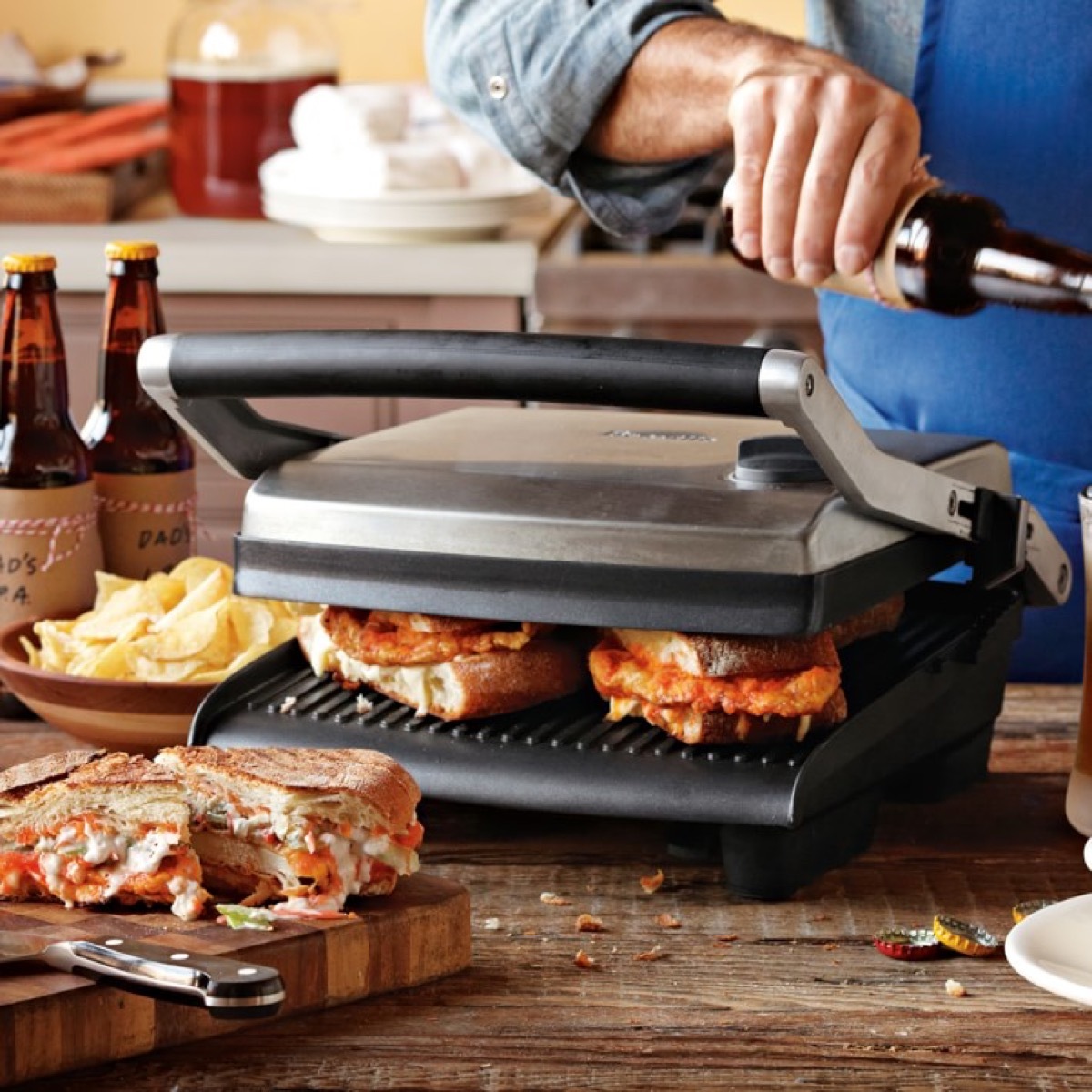 Person making sandwiches on panini press