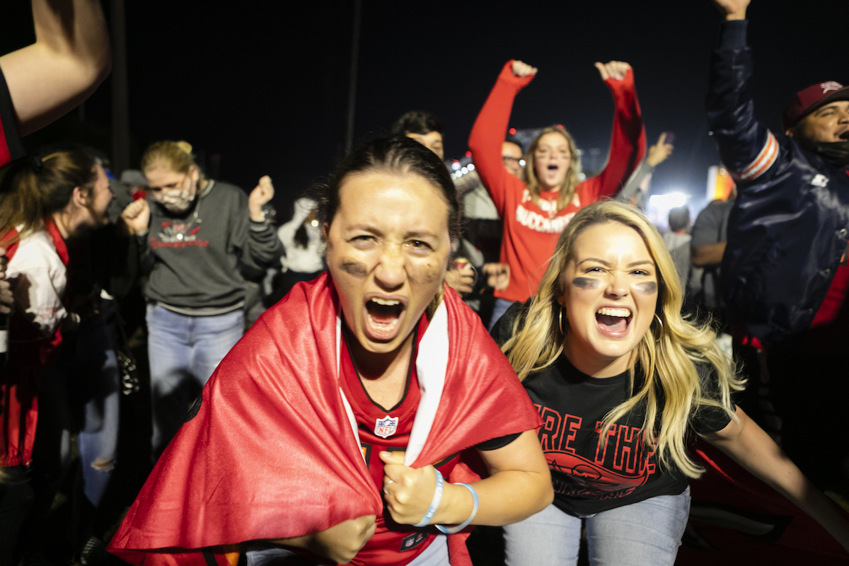 Tampa Bay Buccaneers' fans celebrate their victory outside Raymond James Stadium after winning the Super Bowl LV, in Tampa, Florida, United States on February 07, 2021. 