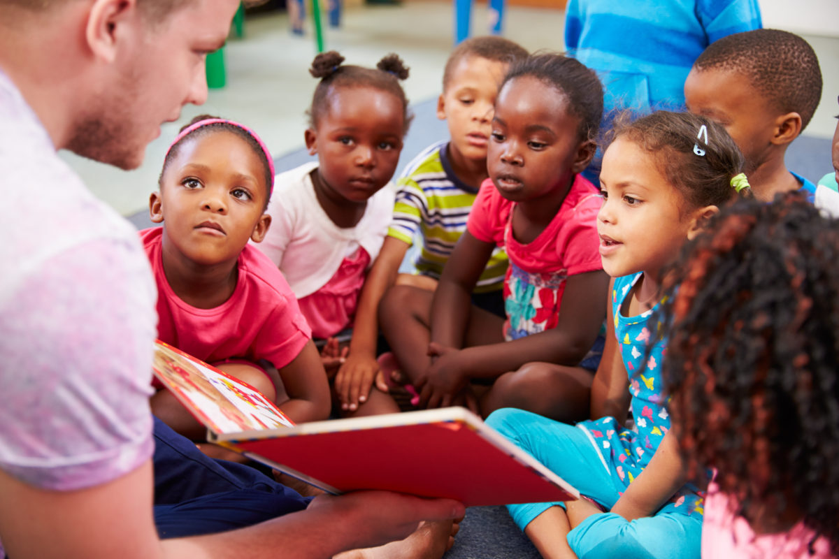 Man Reading to Kids