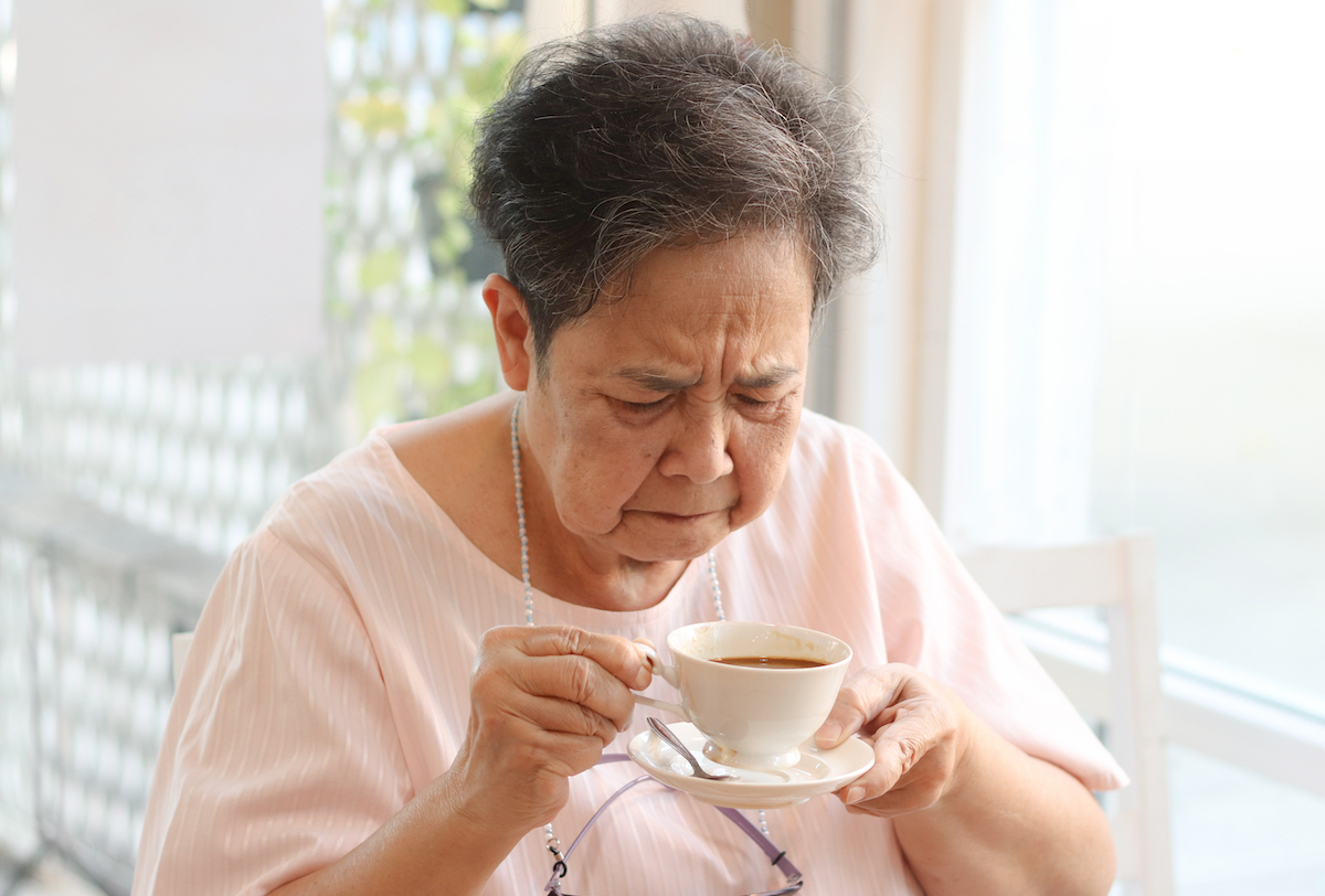 senior woman getting a weird taste in her mouth