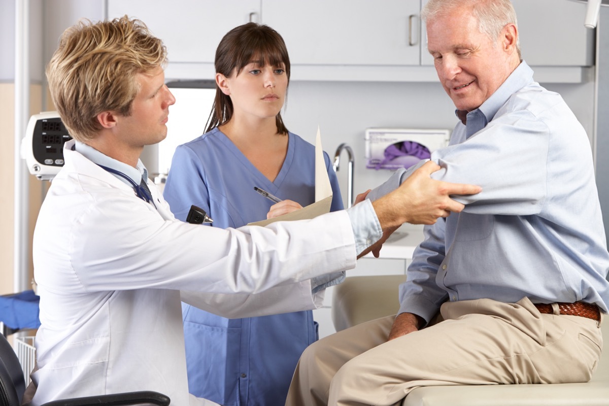 a man getting a check up at doctor