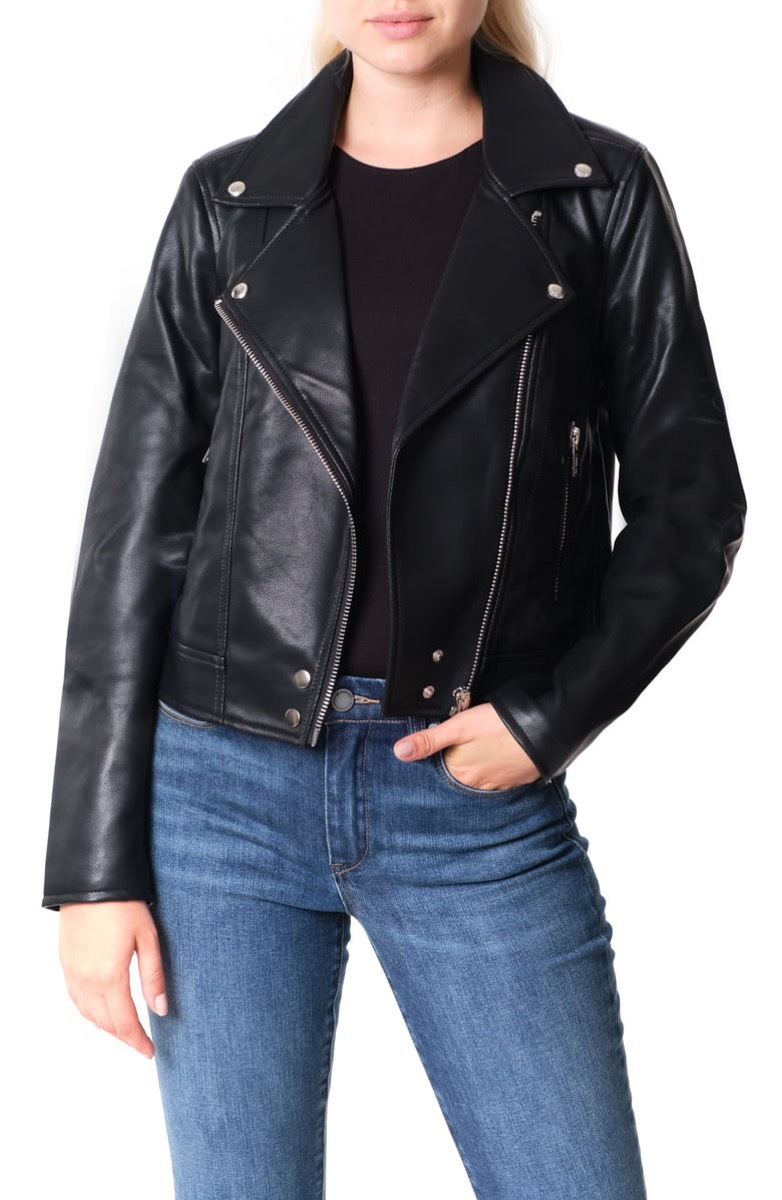 white woman in black leather moto jacket