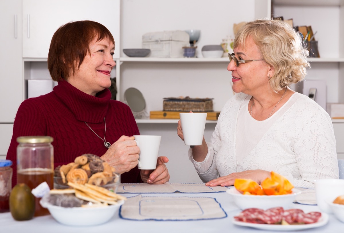 older friends talking over coffee