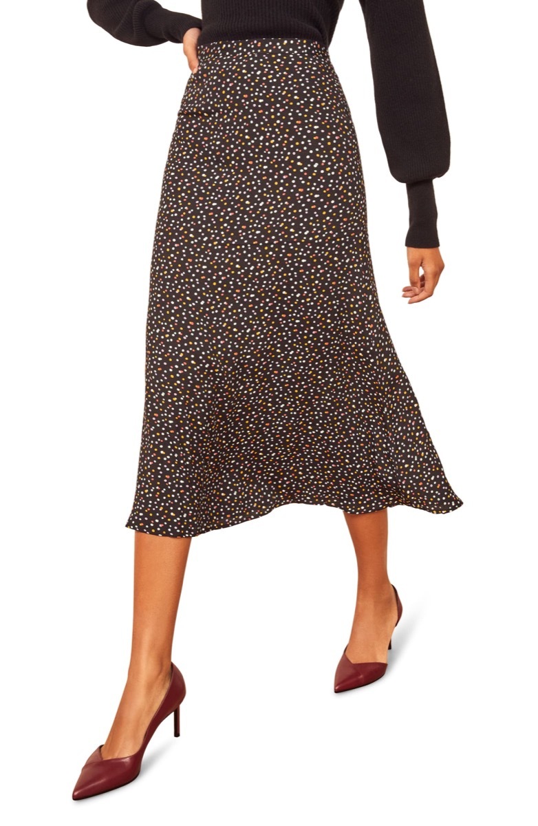 woman in midi skirt