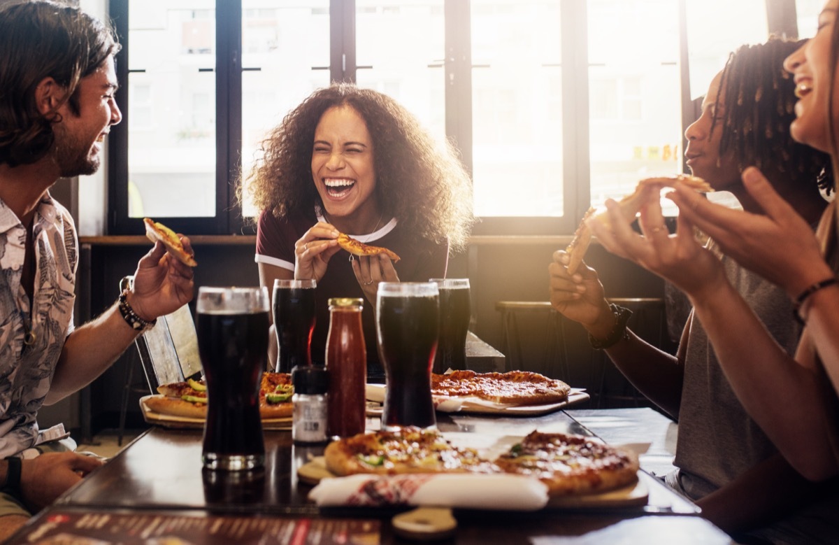 Friends eating out at a restaurant together