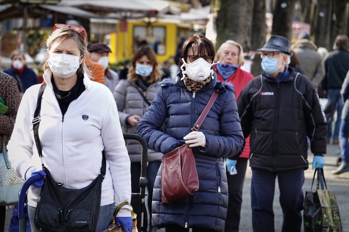 People wearing masks in street