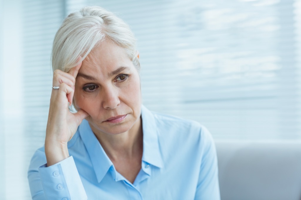 older woman looking sad, empty nest