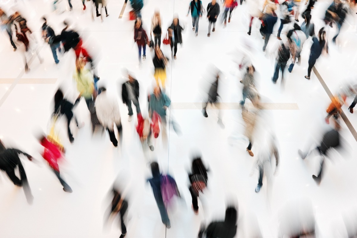 crowd of people in a rush shopping