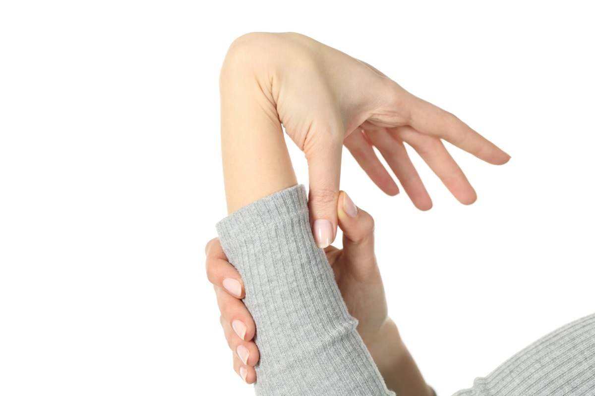 woman hypermobile hand bending wrist and thumb