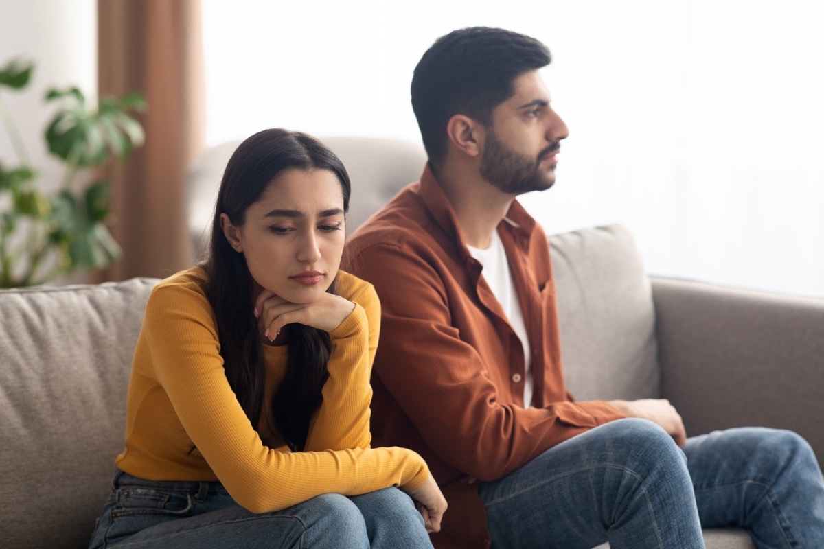 unhappy couple on couch