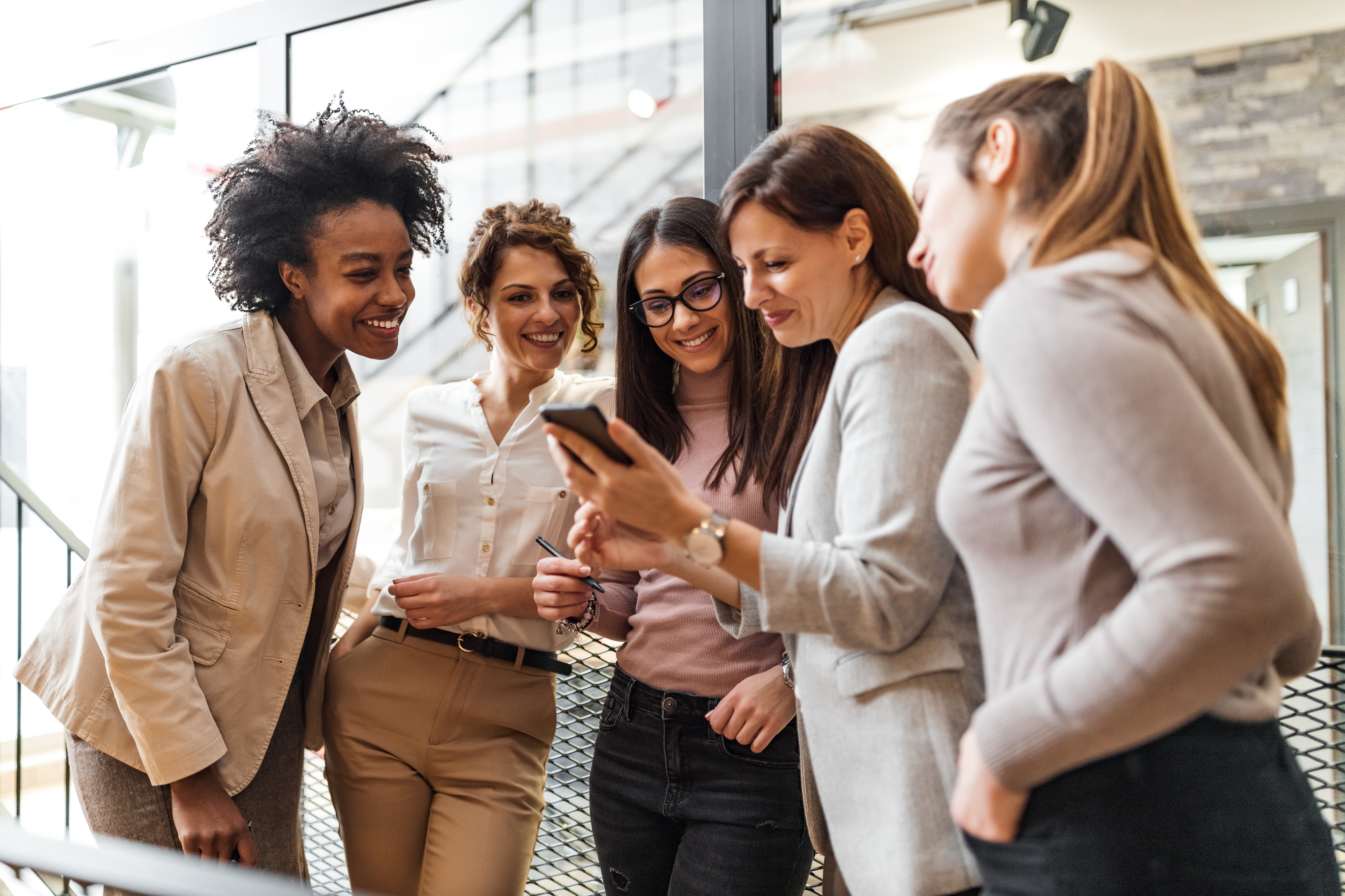 group of female coworkers deciding on a funny team name