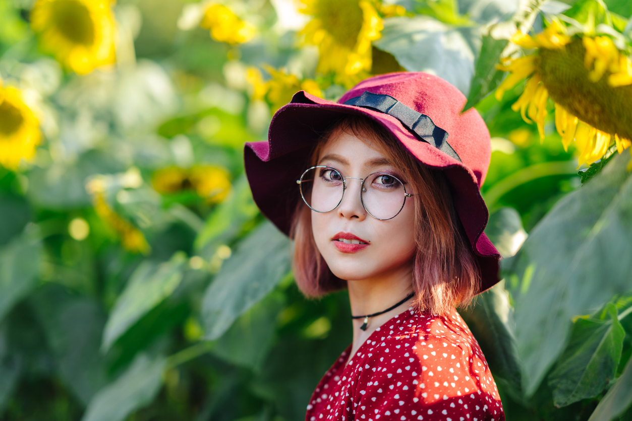 young asian woman wearing stylish red hat