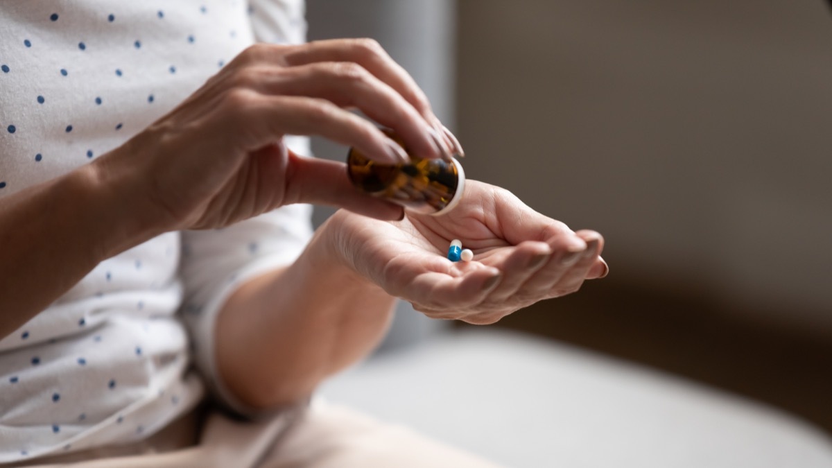 Woman taking a medication