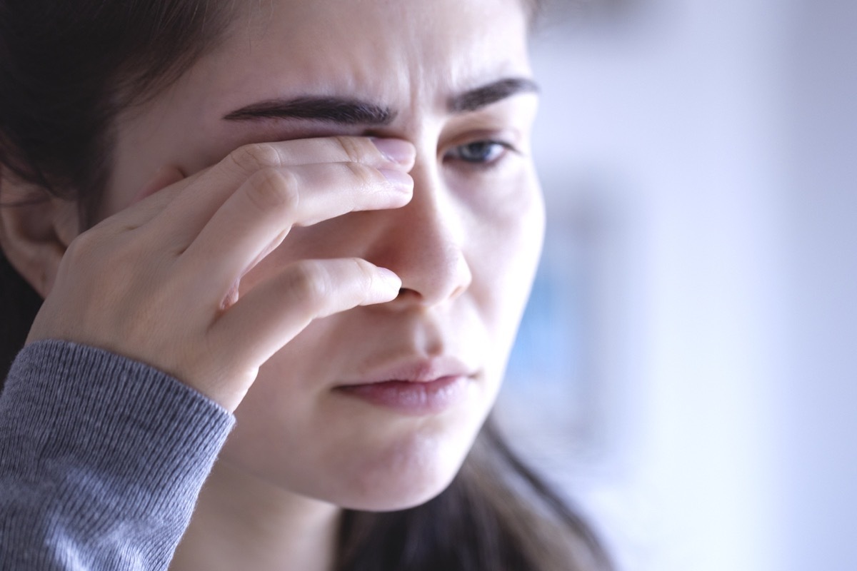 young woman with sore eyes