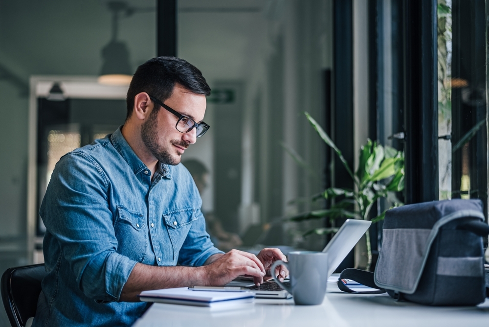 hardworking man at computer