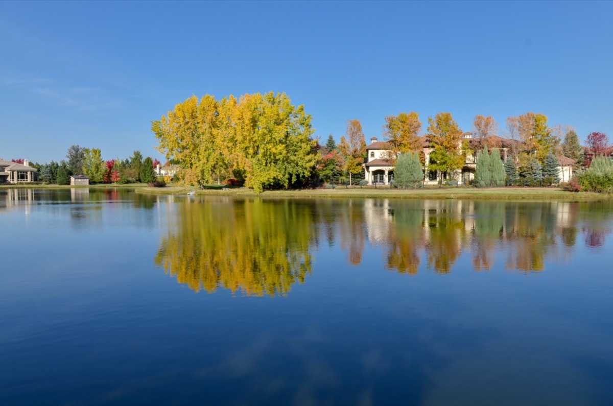 a lake, trees, and houses in Cherry Hills Village, Colorado