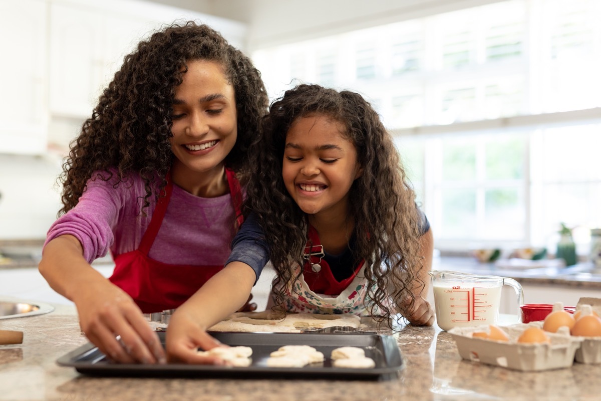 Mother and daughter making holiday cookies