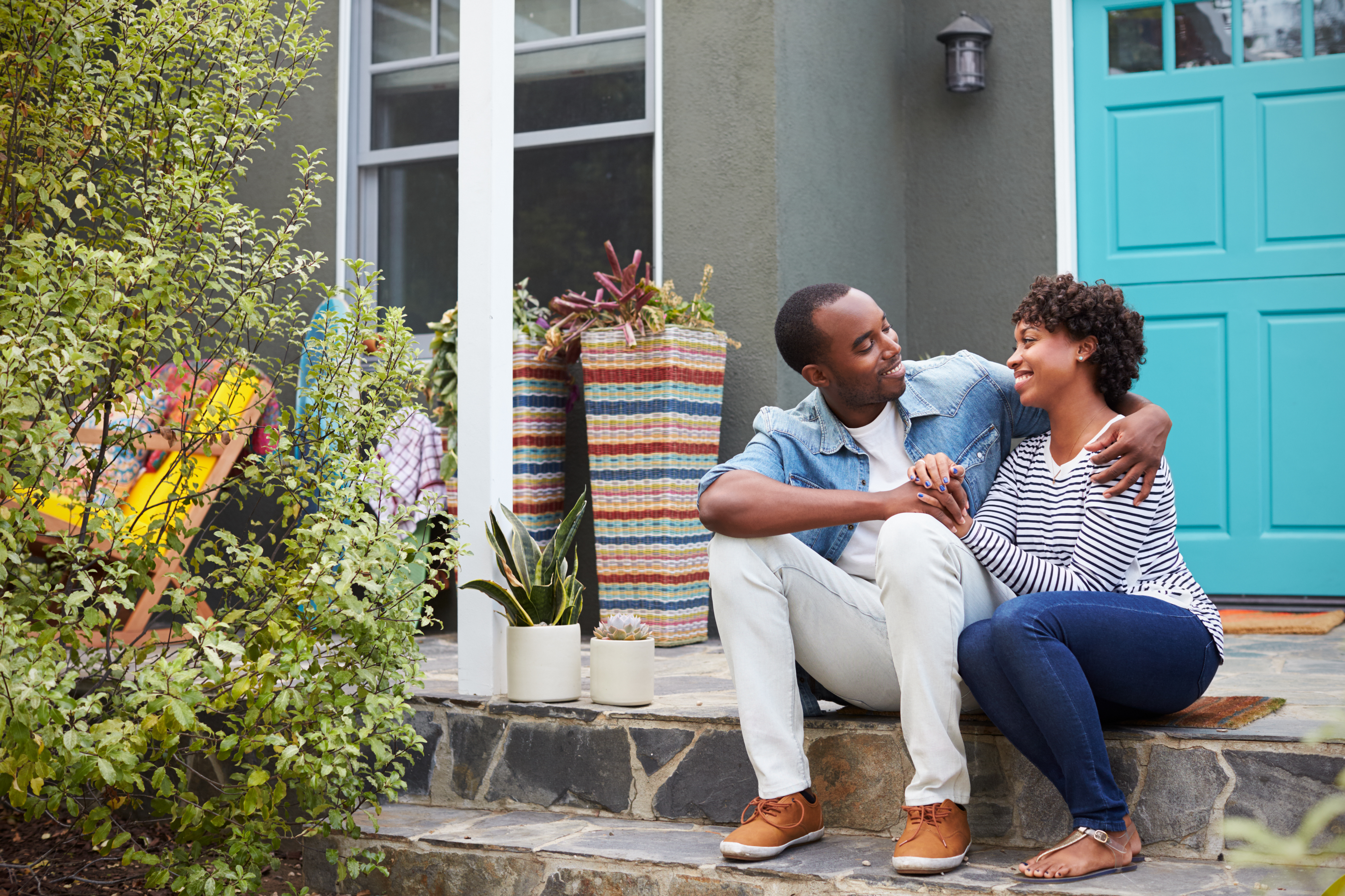 man and woman sitting on front stoop, what he wants you to say