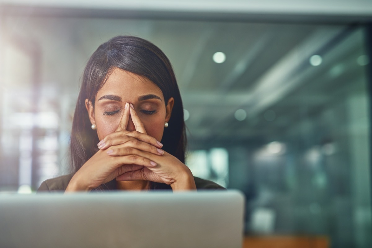 woman feeling drained at desk job