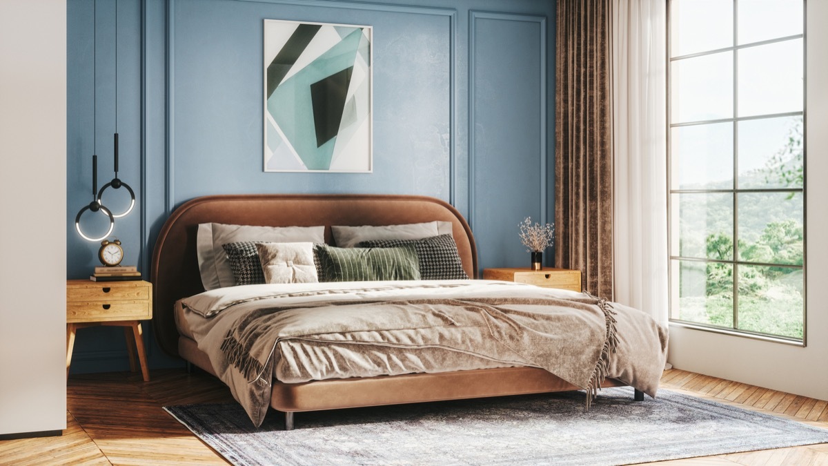 Interior of a modern bedroom decorated with modern furniture with pastel tones.