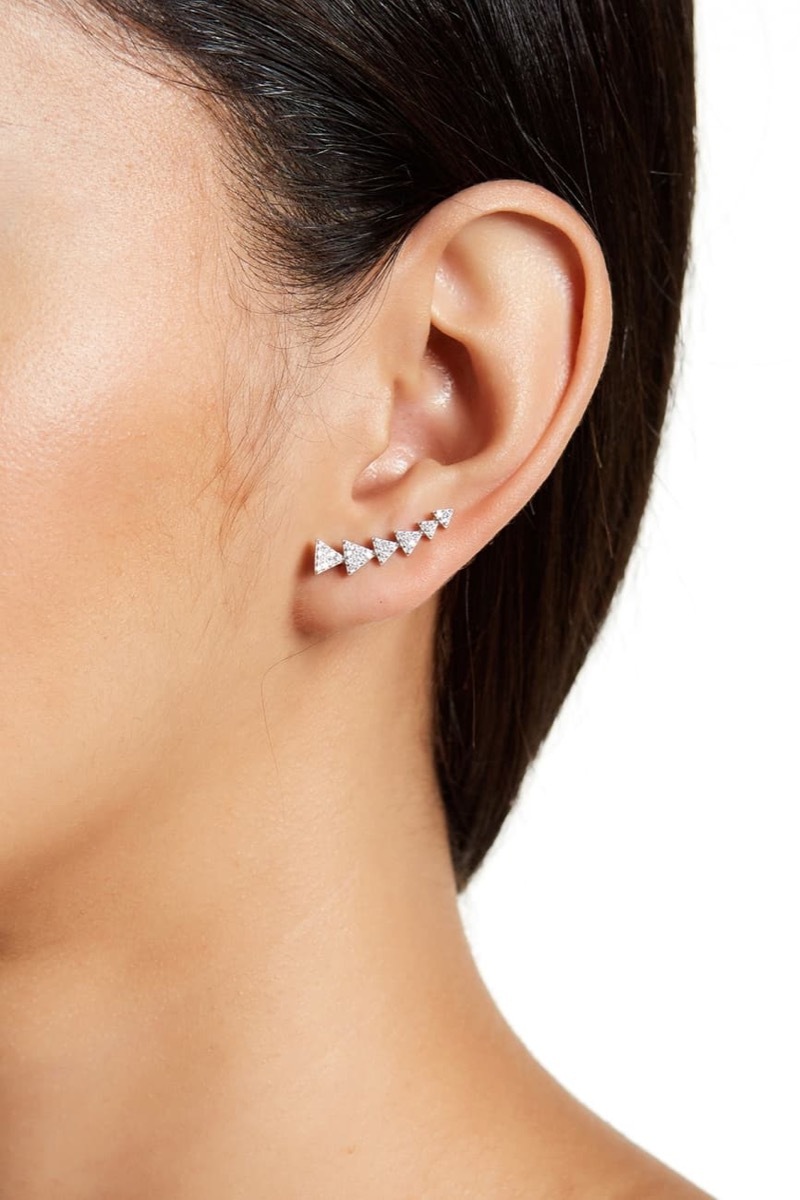 woman wearing silver ear climbers