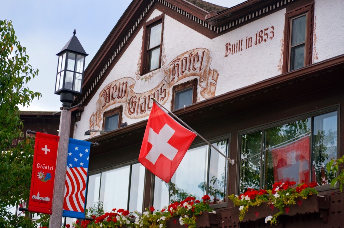 swiss-style house with a swiss flag