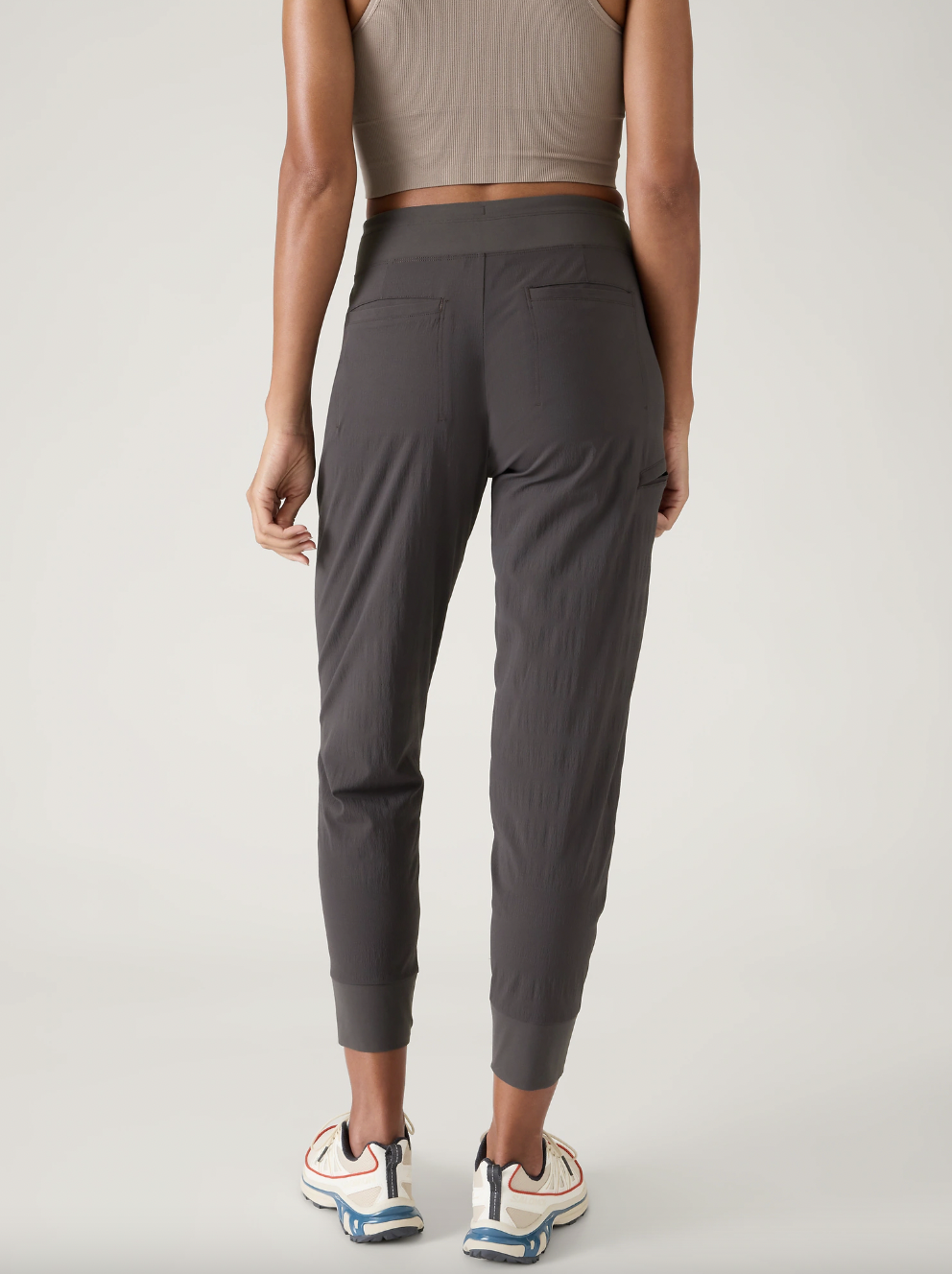 Rear view of model wearing gray Athleta Trekkie North Joggers