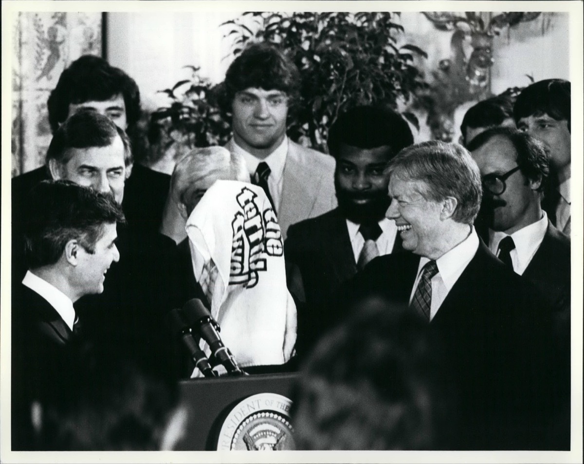 President Carter Receives a ''Terrible Towel'' as members of the Pittsburgh Pirates and Steelers look on. The Steelers & Pirates were given a reception by the President in Honor of Super Bowl and World Series Victories.