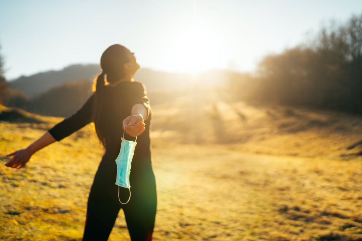 Woman celebrating without mask