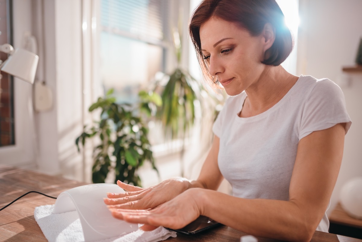 Woman looking at her nails