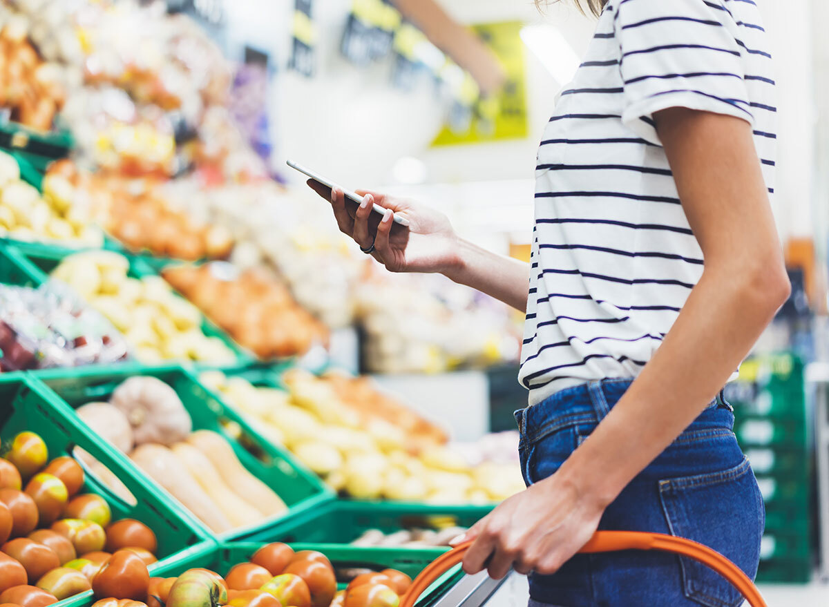 touching phone grocery store