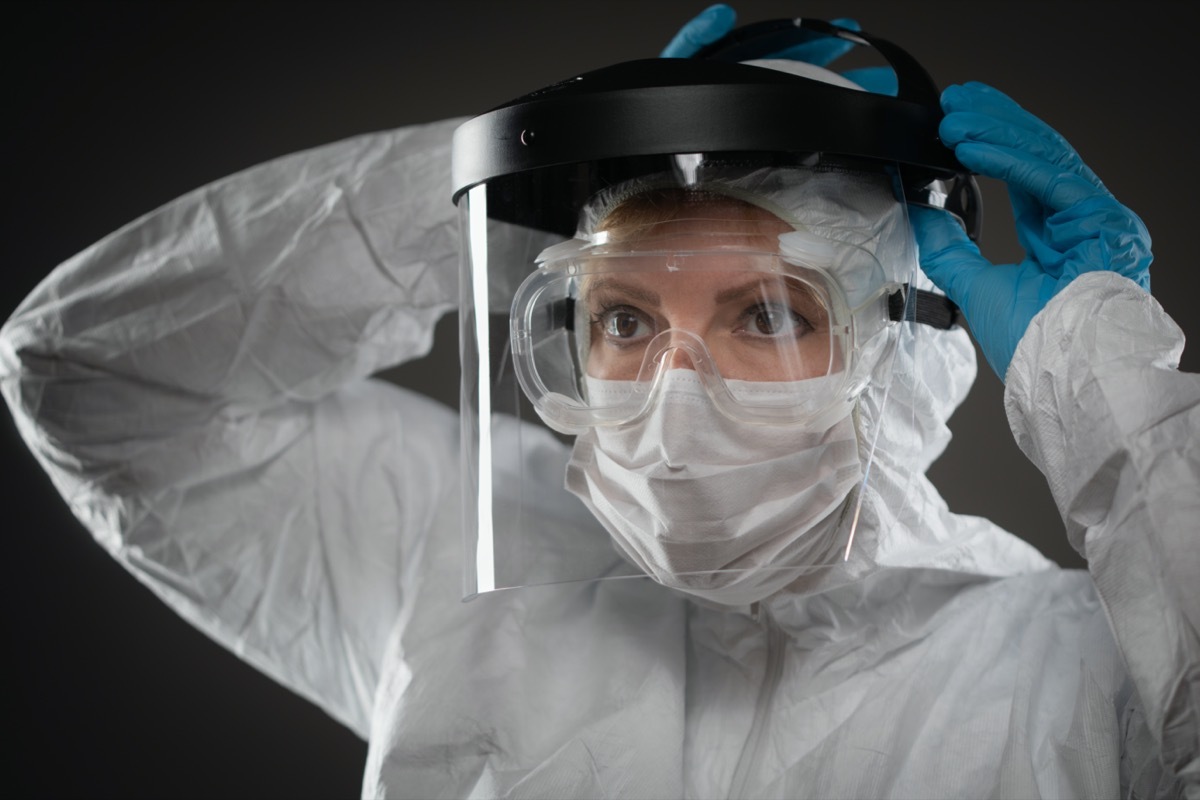 Female Medical Worker Wearing Protective Face Mask and Gear