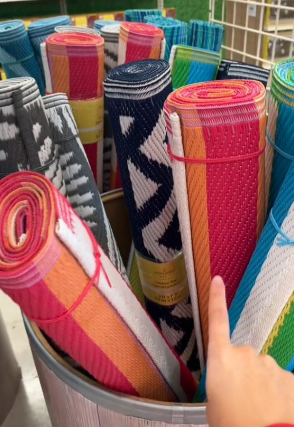 outdoor rugs display at Michaels