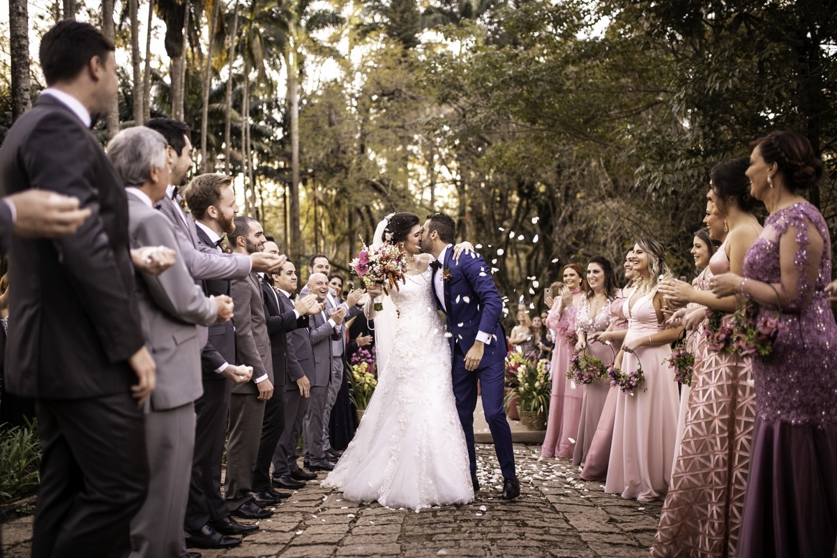 Confetti throwing on happy newlywed couple