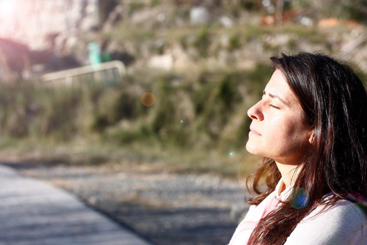 Woman enjoying the sun in the park