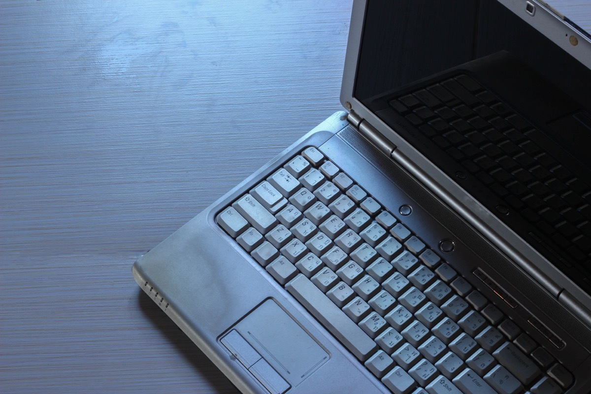 An old laptop on a table