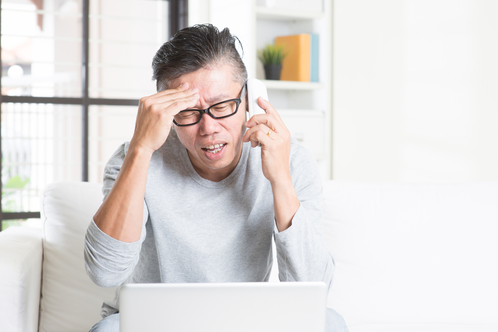 man yelling into phone, over 50 regrets