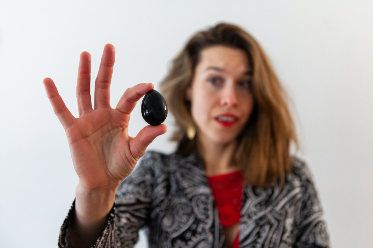 woman holds jade egg