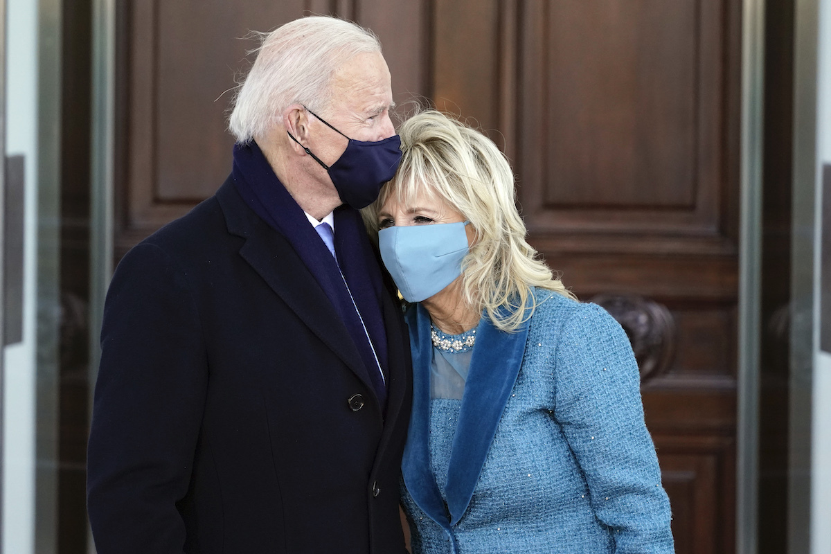 President Joe Biden and first lady Dr. Jill Biden hug as they arrive at the North Portico of the White House, on January 20, 2021, in Washington, DC. 