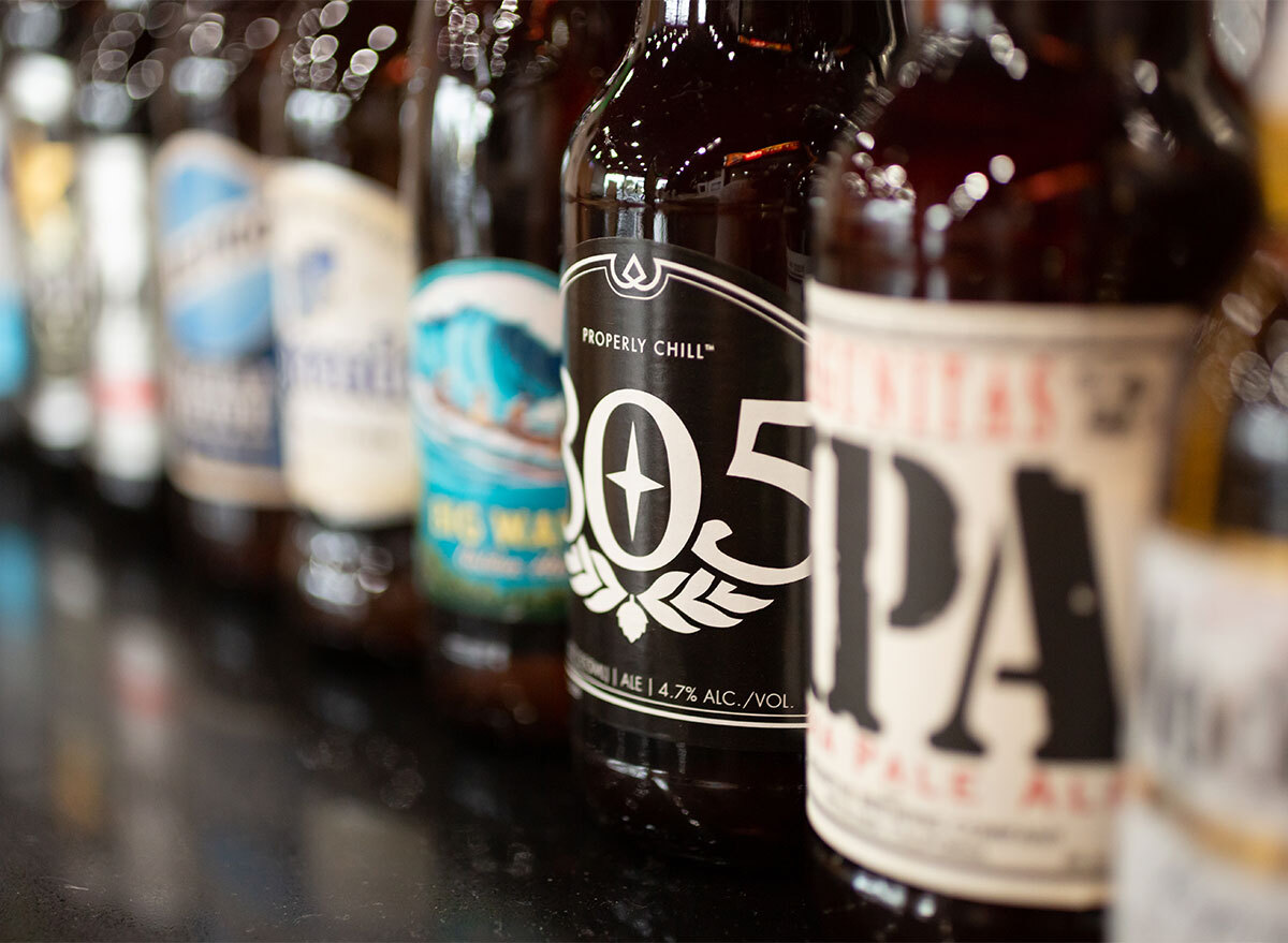 beer bottles lined up on bar