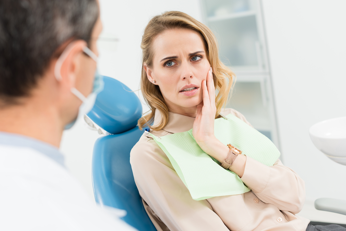 Woman at dentist with pain in her jaw