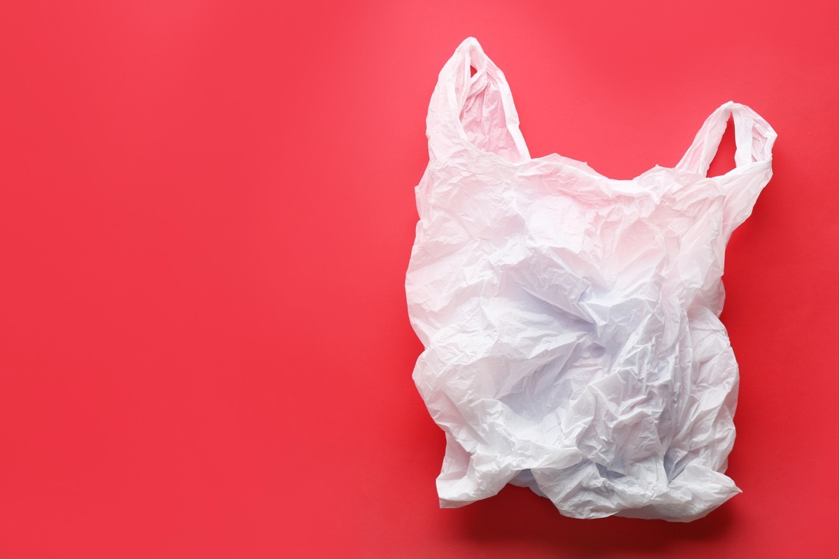 clear disposable lastic bag on red background