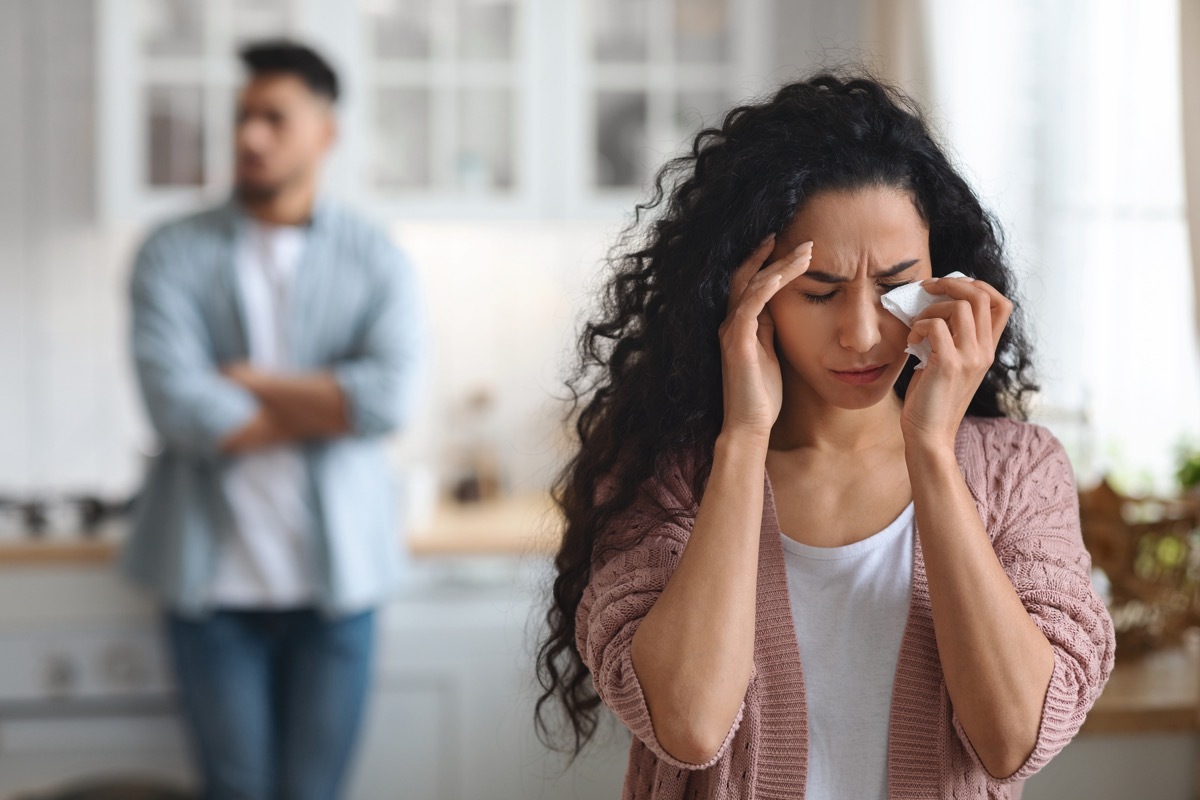 Woman Crying In Kitchen After Quarrel With Husband