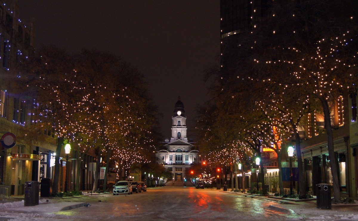 A nighttime view of the Tarrant County Courthouse in Fort Worth, Texas, from the middle of Main Street.