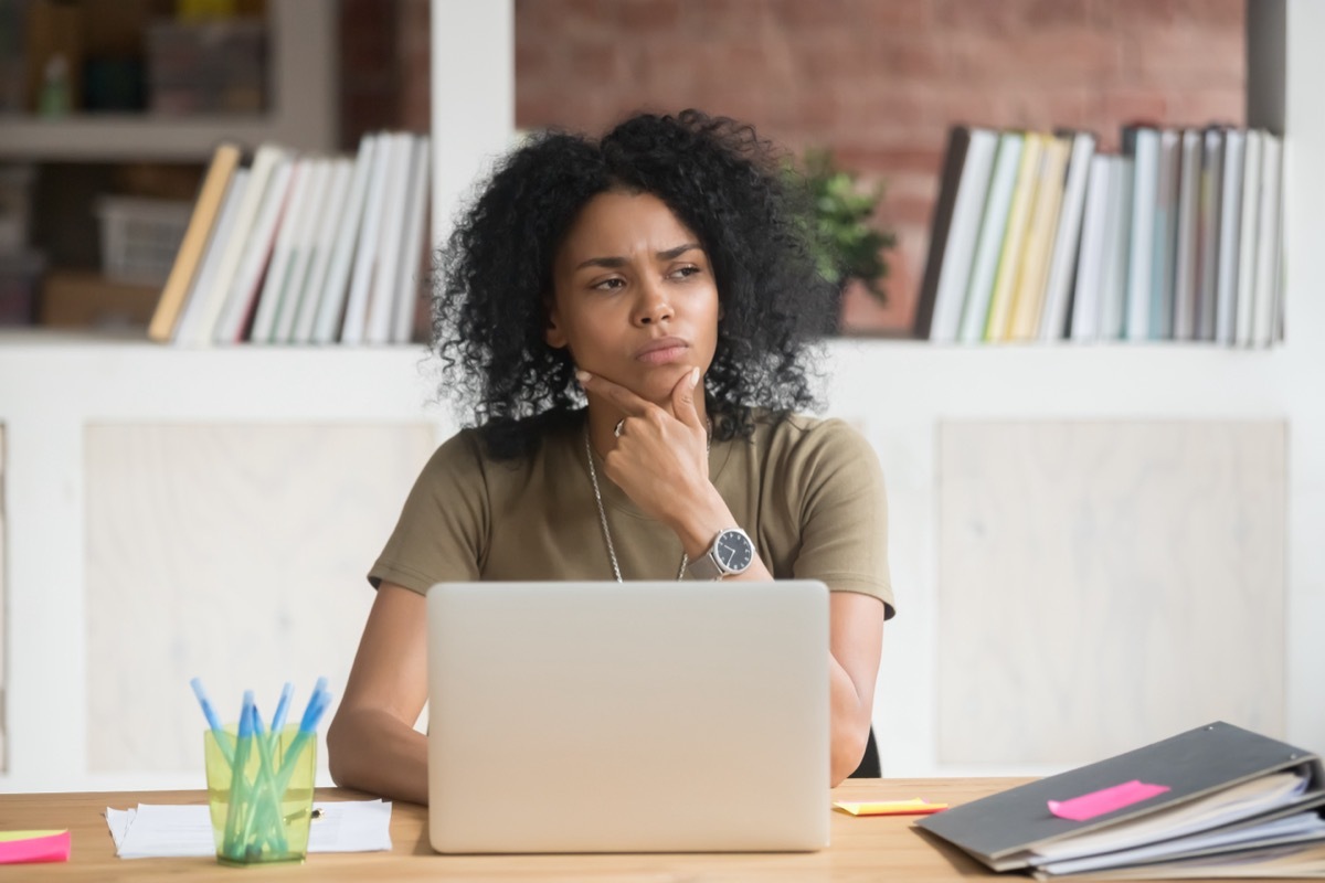 Woman Thinking Hard at Computer