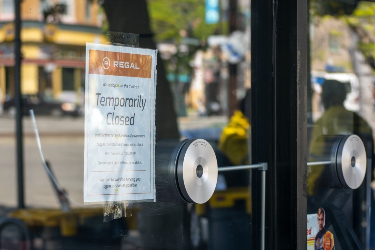 regal movie theater with sign indicating closure amid coronavirus