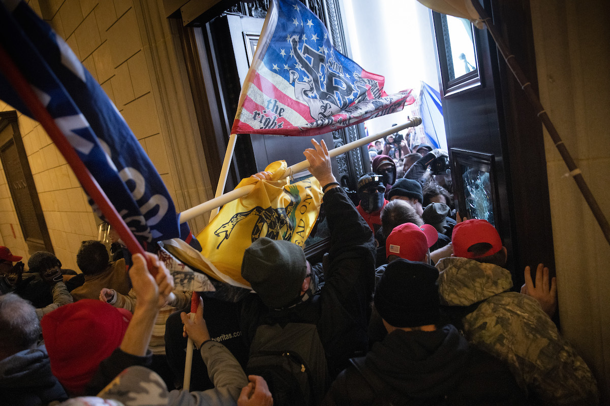 A pro-Trump mob breaks into the U.S. Capitol on January 06, 2021 in Washington, DC. Congress held a joint session today to ratify President-elect Joe Biden's 306-232 Electoral College win over President Donald Trump. A group of Republican senators said they would reject the Electoral College votes of several states unless Congress appointed a commission to audit the election results.