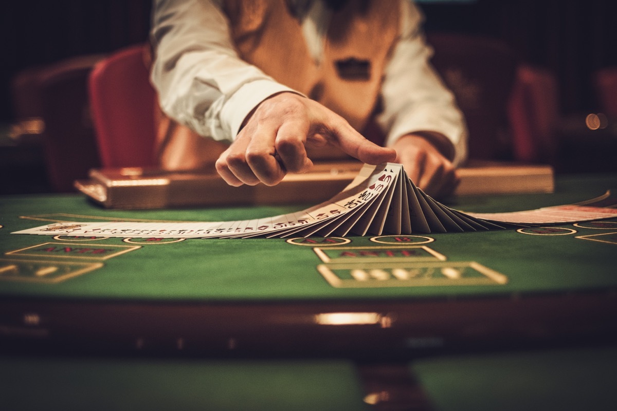 Croupier behind gambling table in a casino