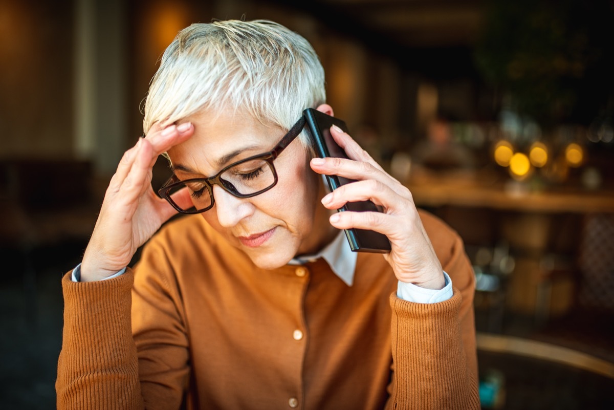 woman stressed out while she's on the phone