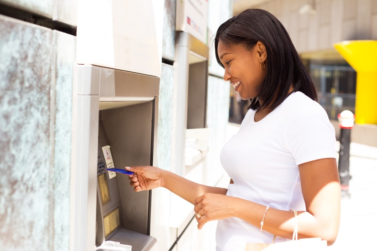 young woman at the atm